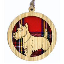 Load image into Gallery viewer, Wooden ornament with a Scottie Dog design and tartan background