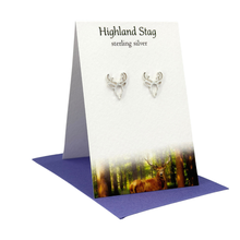 Load image into Gallery viewer, Silver stag earrings on a 'Highland Stag' branded card with a stag in a forest background.