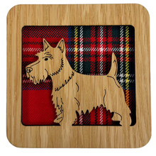Load image into Gallery viewer, Wooden coaster with a Scottie Dog on a tartan background