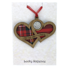 Load image into Gallery viewer, Wooden Plaque shaped with two hearts joined with lucky sixpence and tartan background