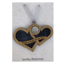 Load image into Gallery viewer, Wooden Plaque shaped with two hearts joined with lucky sixpence and tartan background, engraved with Happy Valentines Day
