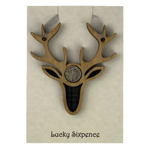 Load image into Gallery viewer, Lucky Sixpence in the centre of a stag wooden plaque and tartan background