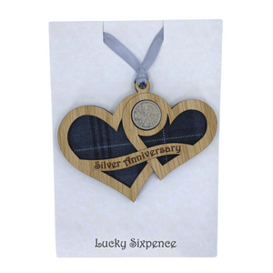 Wooden Plaque shaped with two hearts joined with lucky sixpence and tartan background