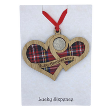 Load image into Gallery viewer, Wooden Plaque shaped with two hearts joined with lucky sixpence and tartan background
