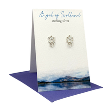 Load image into Gallery viewer, Silver earrings on a display card with 'Angel of Scotland' text, set against a scenic background.
