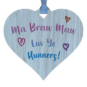 A hanging heart plaque featuring the phrase "Ma Braw Maw"