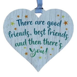 A hanging heart plaque featuring the phrase "Good Friends"