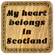 Load image into Gallery viewer, Wooden Mug Coaster with 'Suns Oot Taps Aff' text with tartan background
