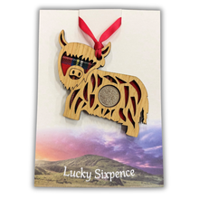 Load image into Gallery viewer, Lucky Sixpence Wooden Plaque in the shape of a highland cow
