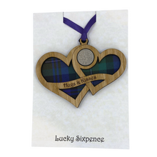 Load image into Gallery viewer, Wooden Plaque shaped with two hearts joined with lucky sixpence and tartan background, engraved with Hugs &amp; Kisses
