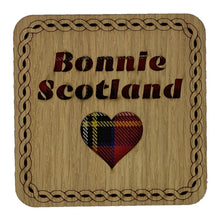 Load image into Gallery viewer, Wooden Mug Coasert Scottish Themed Gift with &#39;Bonnie Scotland&#39; in tartan text
