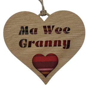 A hanging heart plaque with a tartan background featuring the phrase "Ma Wee Granny" and heart design.