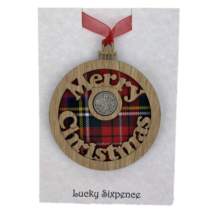 Merry Christmas Lucky Sixpence on an oak veneered surround and a Royal Stewart tartan background