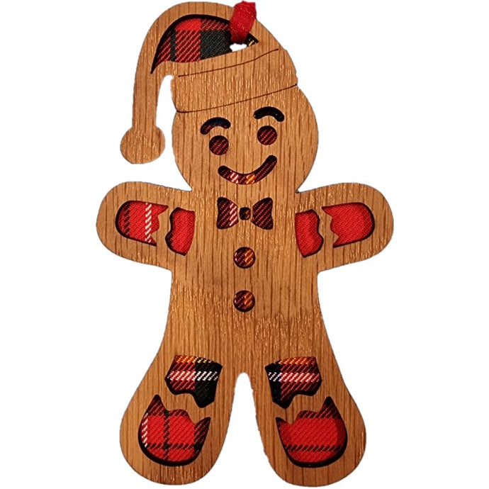 Christmas Gingerbread Man Hanging Plaque on an oak veneered surround and a Royal Stewart tartan background.