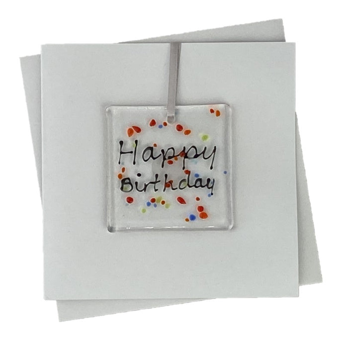 Happy birthday handmade card with fused glass art hanging over the front of the card