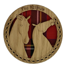 Load image into Gallery viewer, Round Wooden Mug Coaster with Red tartan background and kelpie design

